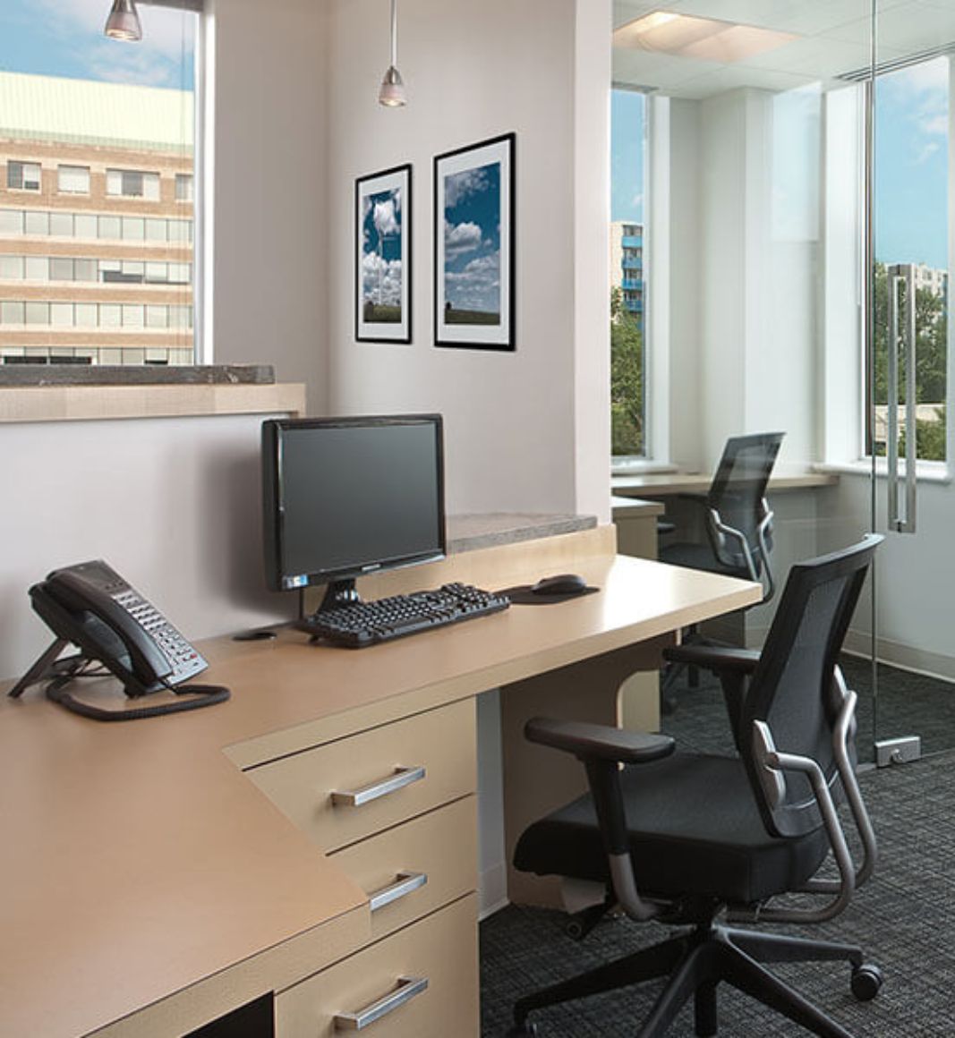 A picture of a desk in the office